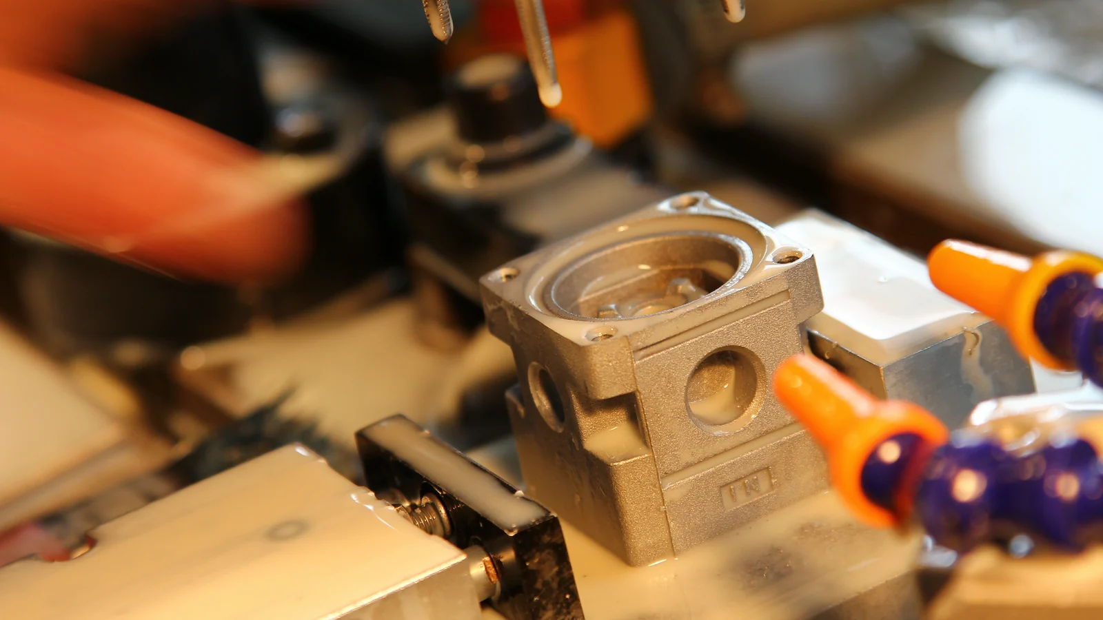 A metal component secured for machining at XMC